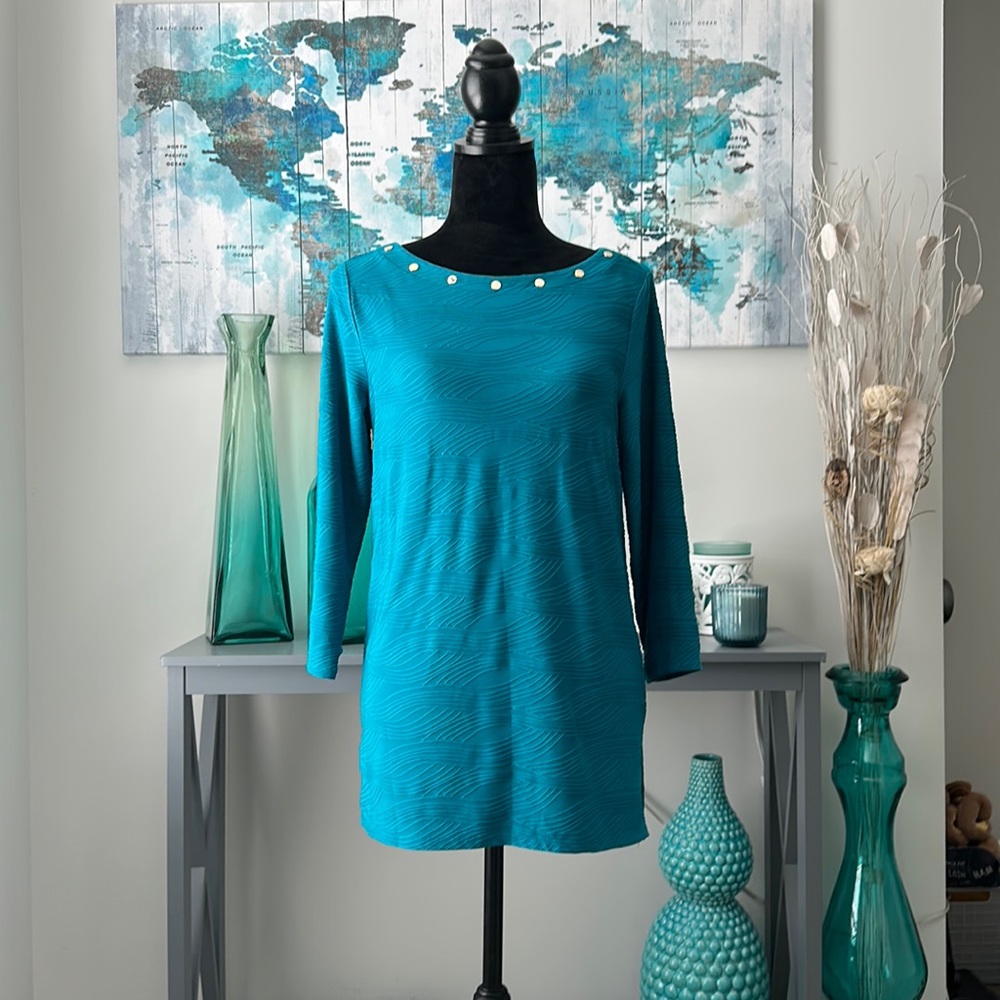 Teal shirt with long sleeves and collar detail with wavy design. Dana Buchman.